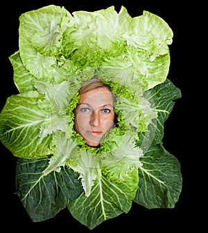 Woman with salal leafes around her head.