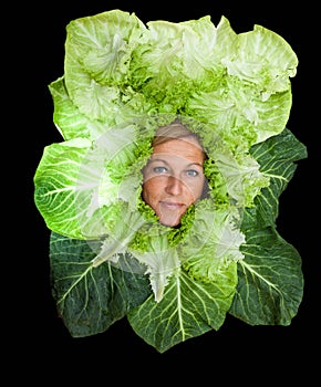 Woman with salal leafes around her head.