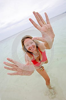 Woman with Sandy Hands