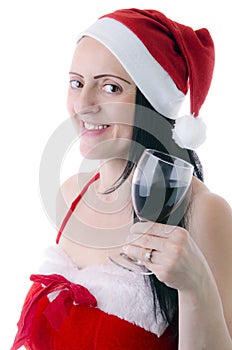 Woman in Santa Claus clothes with glass of red wine