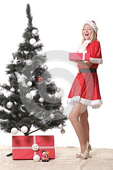 Woman in Santa Claus clothes with presents