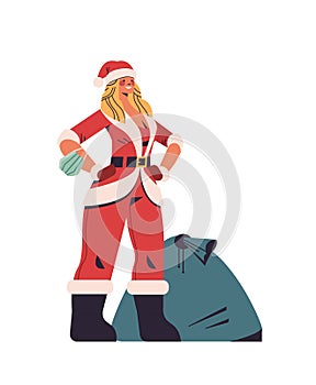 Woman in santa claus costume standing near sack full of gifts happy new year merry christmas holiday celebration