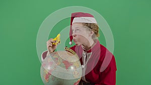 Woman Santa Claus Flying A Plane On A Globe