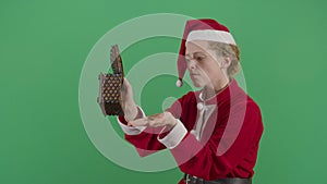 Woman Santa Claus Looking For Money In A Chest