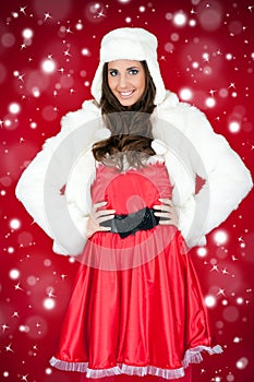 Woman in santa costume and white furry hat