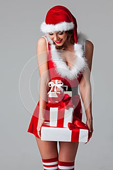 Woman in santa dress with gift