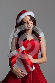 Woman in santa dress with gift