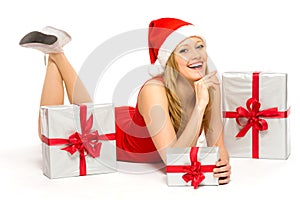 Woman in Santa hat with Christmas presents