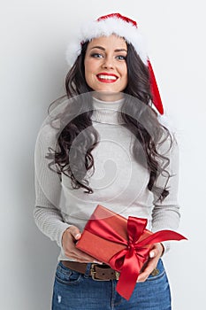 Woman in Santa hat with gift