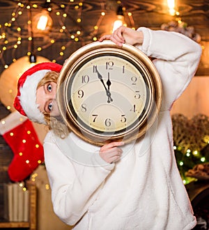 Woman Santa hat hold vintage clock. Time to celebrate. New year countdown. Unexpectedly soon. Midnight concept. Make