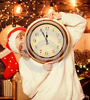 Woman Santa hat hold vintage clock. Time to celebrate. New year countdown. Unexpectedly soon. Midnight concept. Make photo