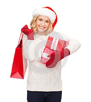 Woman in santa helper hat with shopping bags