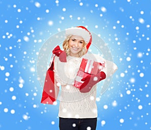 Woman in santa helper hat with shopping bags