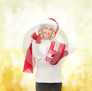 Woman in santa helper hat with shopping bags