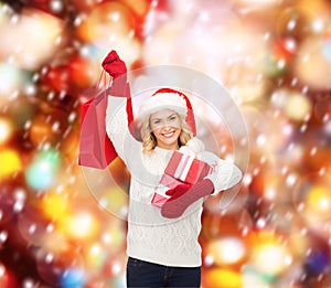 Woman in santa helper hat with shopping bags