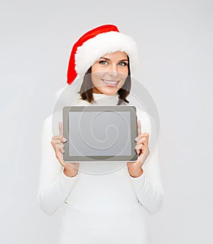 Woman in santa helper hat with tablet pc