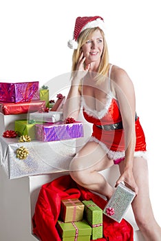 Woman Santa in traditional dress holding gifts
