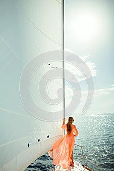 Woman in sarong yachting white sails luxury travel