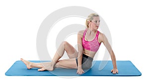 Woman sat on an exercise mat