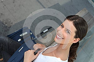 Woman sat at train station