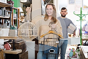 Woman satisfied with purchases in furnishings store