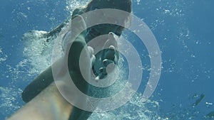 Woman Savior Rescuer Saving Drowning Man Underwater View. Hope Concept