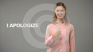 Woman saying i apologize in sign language, text on background, communication