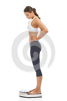 Woman, scale and for lose weight diet in studio for healthy body, performance or self care. Female person, equipment and