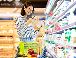 Woman scanning code on products using smartphone