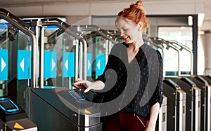 Woman scanning phone for entry into modern building or secure corporate company using contactless sensory scanner device