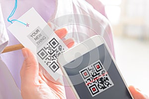 Woman scanning QR code