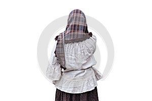 A woman in a scarf and old clothes at the entrance to the old European