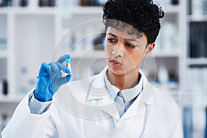 Woman, scientist and blood sample in vial for research, medical study and experiment with test. Lab, investigation and