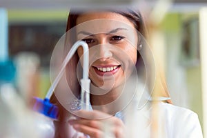 Woman scientist carrying out experiment in research laboratory