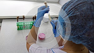Woman scientist conducting research in the laboratory. Biotechnologies.