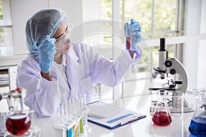 Woman scientist in lab look at science microscope medical test and research biology chemistry. Females technician laboratory
