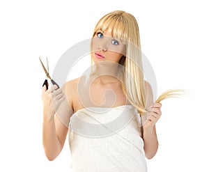 Woman with scissors looking surprised
