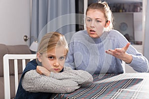 Woman scolding her daughter
