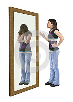 Woman scolding herself in a mirror