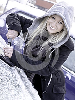 Woman scraping ice