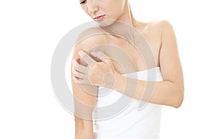 Woman scratching her arm