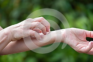 Woman scratching her arm