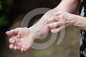 Woman scratching her arm