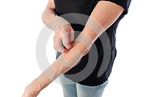 Woman scratching her arm