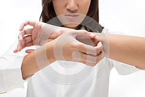 Woman scratching her arm