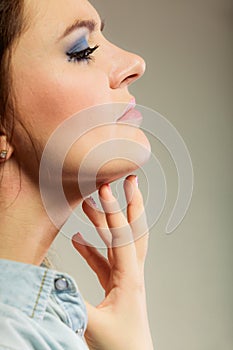 Woman scratching her neck