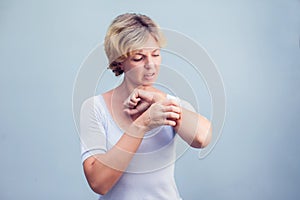 Woman Scratching an itch on white background . Sensitive Skin, F