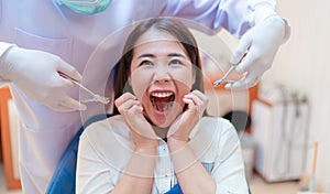 Woman scream,fear before dental teeth examined dentist check-up