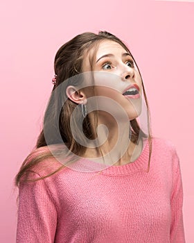 The woman screaming with open mouth isolated on pink background, concept face emotion