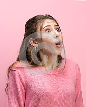 The woman screaming with open mouth isolated on pink background, concept face emotion